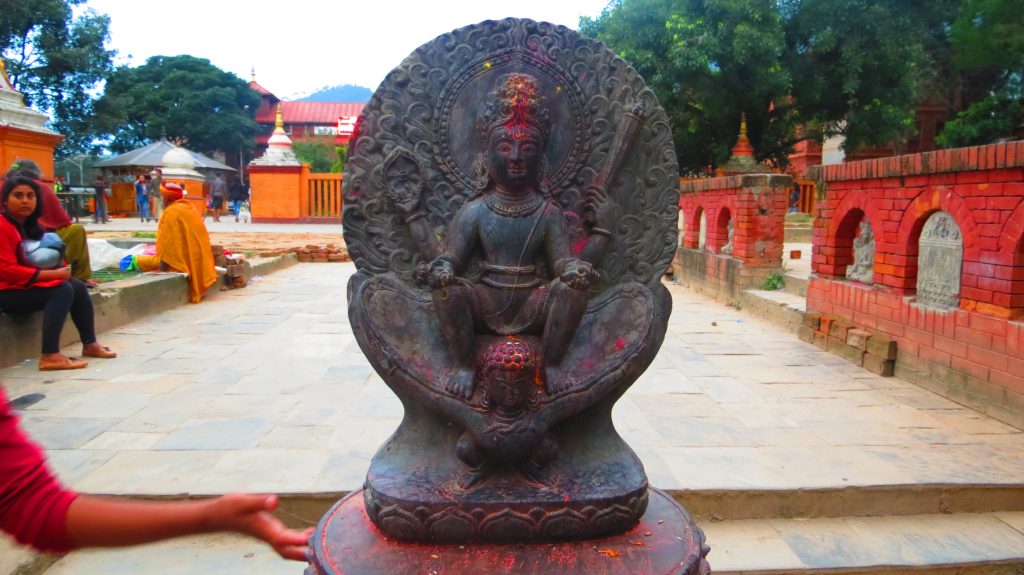 Best Picnic Spots in Budhanilkantha Kathmandu. A statue of Vishnu, sitting on Garuda, at the temple premise.